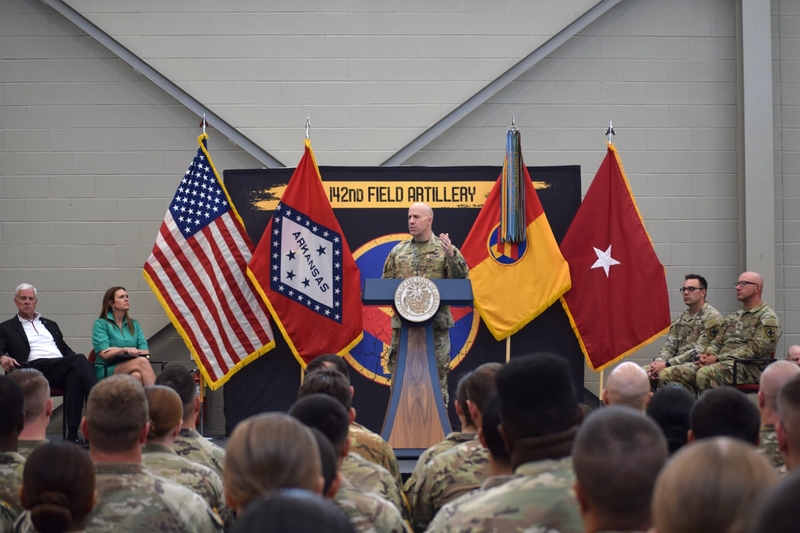 (From left) Congressman Steve Womack and Arkansas Gov. Sarah Huckabee Sanders listen to Brig. Gen. Chad Bridges address the 142nd Field Artillery Brigade