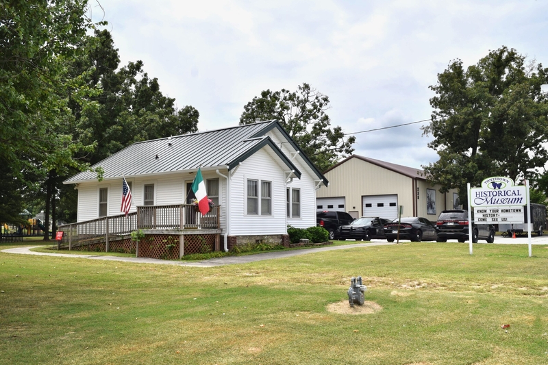 Located along Highway 412, the Tontitown Historical Museum shares a parking lot with the town's police department and a city park.