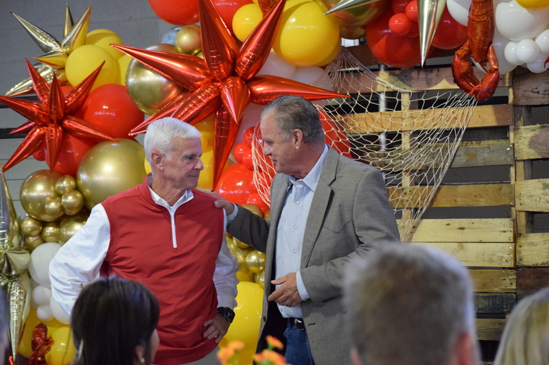 Springdale Mayor Doug Sprouse (right) speaks with U.S. Rep. Steve Womack during the annual Chickin, Peelin’ &amp; Politickin’ networking event at Springdale's Shiloh Square on Oct. 1, 2026.