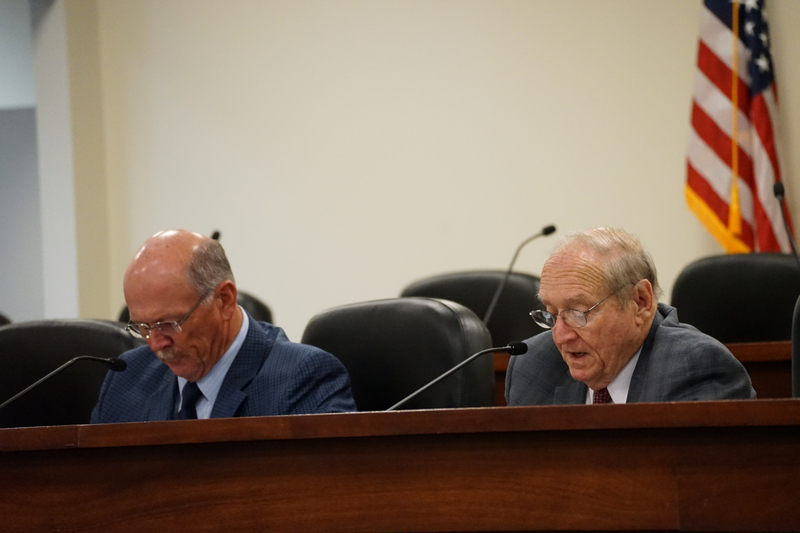 John McMillan, the executive president of the Alabama Medical Cannabis Commission speaks into microphone next to Rex Vaughn, the chairman.