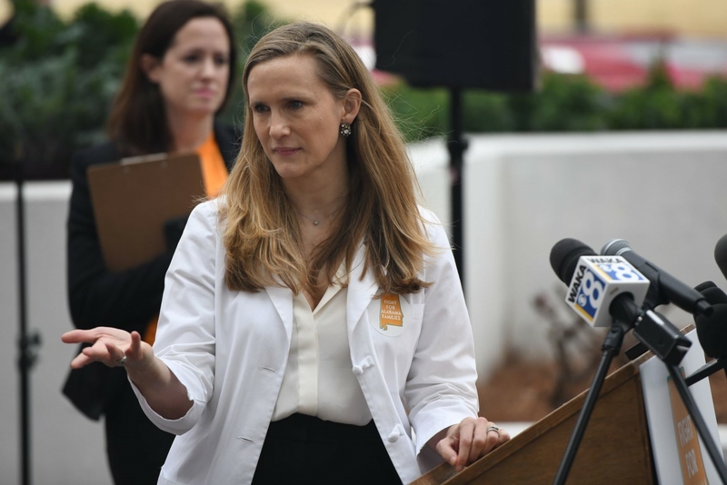 A woman in a medical coat