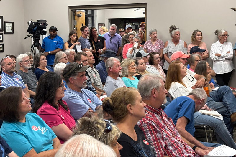 A crowd of people in a city hall