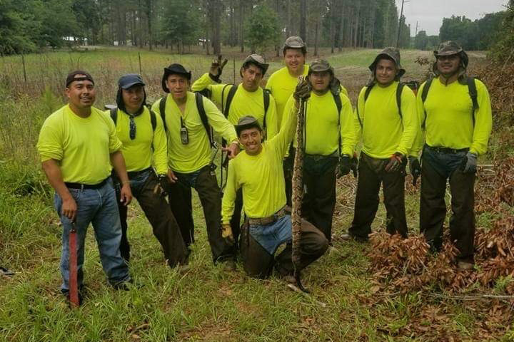 A group of people in reflective shirts
