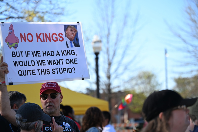 A man holding a sign