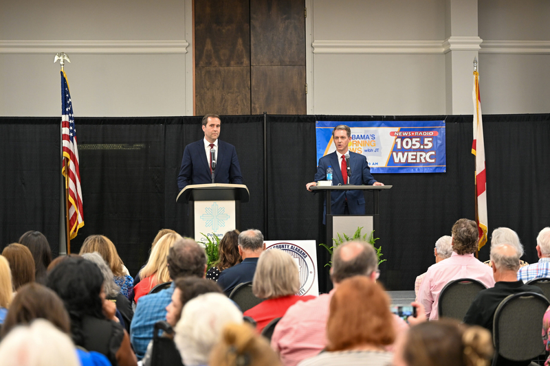 Two men at lecterns