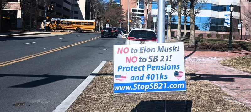 A political sign encouraging opposition to Delaware's Senate Bill 21 is posted near the Wilmington train station in early March.