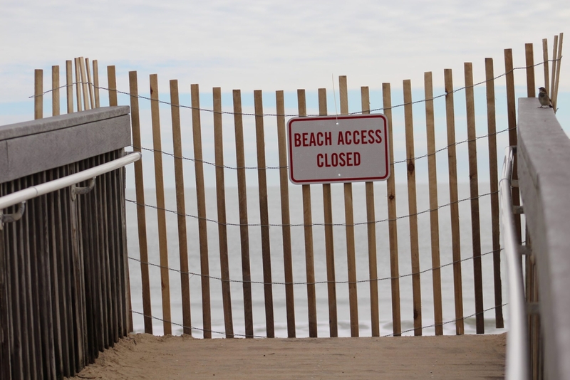 A fence blocks a beach dune crossover in Bethany Beach in late September 2026 with a sign that reads Beach Access Closed.