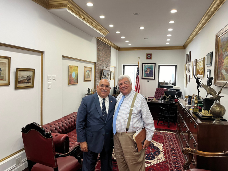 Ravi Batra (left) and Frank Seddio pose for a photo at Batra’s office in Manhattan.