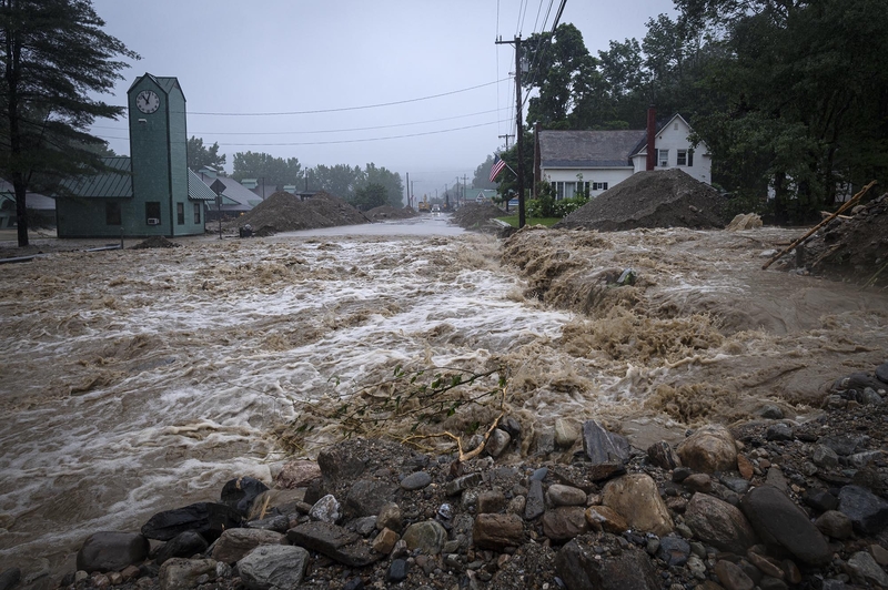 a flooded street in a small town.