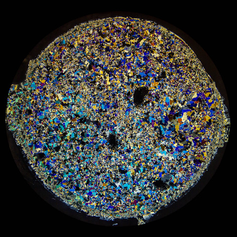 Polarized light shining through a thin section of sea ice reveals a colorful kaleidoscope of crystals. The ice was collected from the Arctic Ocean by University of Alaska Fairbanks scientist Marc Oggier. This pattern was used on garments in the Sea Ice Collection. (Photo by Marc Oggier/University of Alaska Fairbanks)