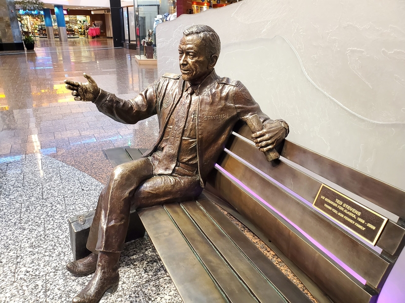 A statue of the late Sen. Ted Stevens is seen on Feb. 25, 2024, at the airport that is named for him, the Ted Stevens Anchorage International Airport. One of the longest-serving U.S. senators in history, Stevens left a legacy that shaped Alaska. (Photo by Yereth Rosen/Alaska Beacon)