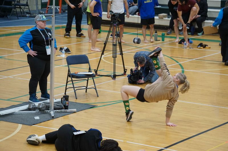 A young athlete competes on March 14, 2024, in the Alaskan High Kick, one of the traditional Indigenous sports events held at the Arctic Winter Games. The events were staged at Colony Middle School in Palmer. (Photo by Yereth Rosen/Alaska Beacon)