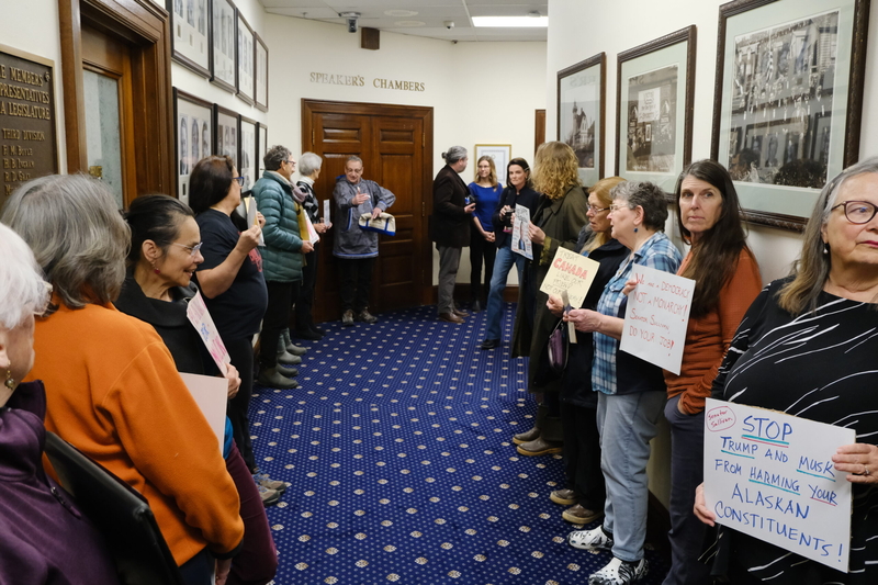 Demonstrators line the hallway headed into the House chamber on March 20, 2025. (Photo by Corinne Smith/Alaska Beacon)