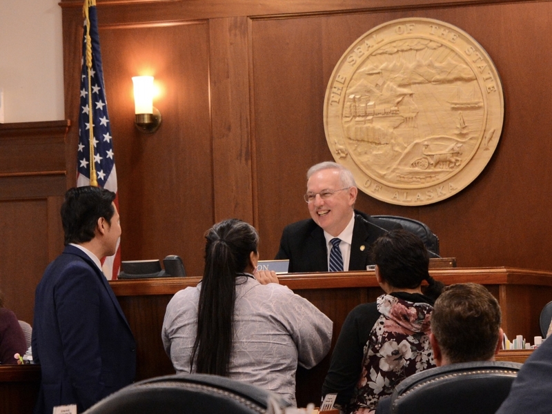 Speaker of the House Bryce Edgmon, I-Dillingham, talks with fellow lawmakers from rural Alaska on Tuesday, May 20, 2025, shortly before the Alaska House of Representatives adjourned for the year. (Photo by James Brooks/Alaska Beacon)
