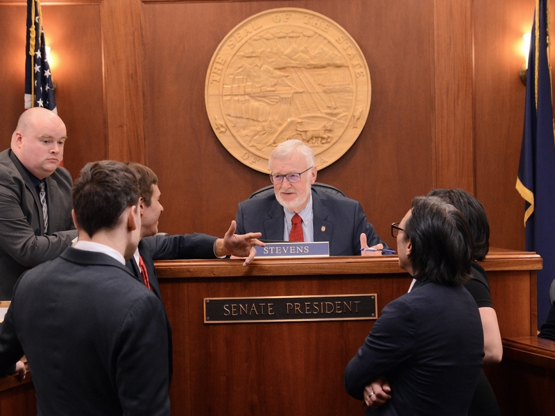 Senate President Gary Stevens, R-Kodiak, talks to fellow legislators shortly before the Alaska Senate adjourned for the year on Tuesday, May 20, 2025. (Photo by James Brooks/Alaska Beacon)