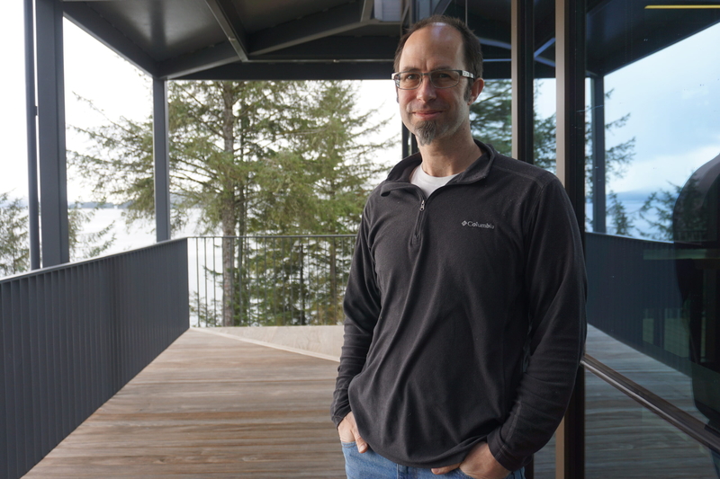 Jason Amundson, a professor of geophysics at the University of Alaska Southeast, stands outside his office on March 11, 2025. He is leading a research project to better understand outburst floods at Mendenhall Glacier and elsehere. (Photo by Yereth Rosen/Alaska Beacon)