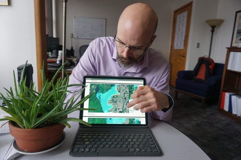 Robert Barr, deputy city manager for City and Borough of Juneau, pulls up a screen on May 13,2025, to show plans for HESCO flood barrier in along the Mendenhall River to protect against glacial outburst flood.(Photo by Yereth Rosen/Alaska Beacon)