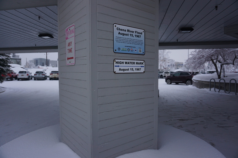 A sign at the Fairbanks North Star Borough office, seen on Feb. 5, 2025, shows how high water rose during that city's devastaing 1967 flood. (Photo by Yereth Rosen/Alaska Beacon)