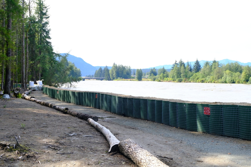 Hesco flood barriers seen along the Mendenhall River at flood levels on Aug 13, 2025 (Photo by Corinne Smith/Alaska Beacon)