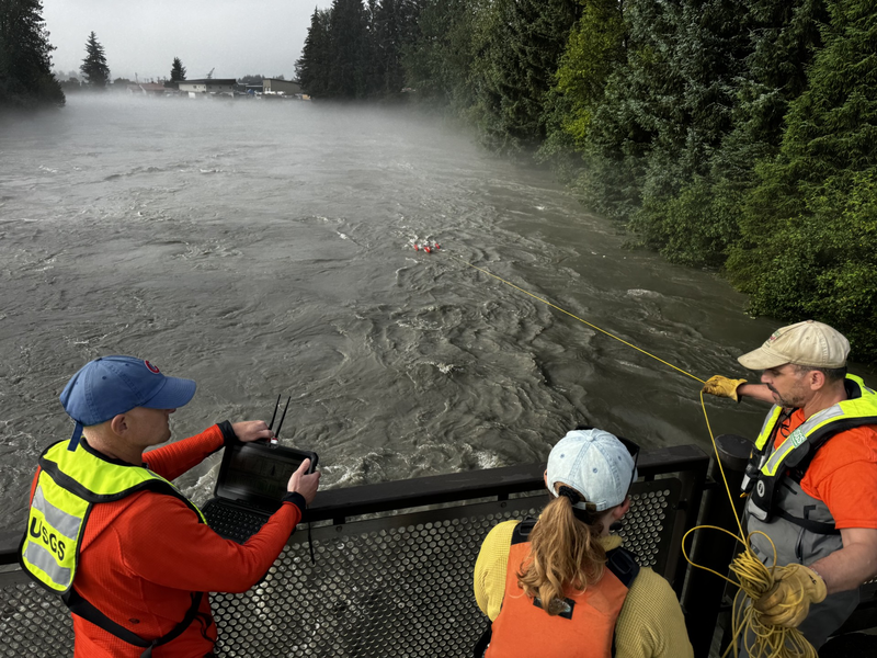 U.S. Geological Survey scientists measure flooding on the Mendenhall River as water releases from Suicide Basin’s glacier-dammed lake on August 13, 2025. (Photo provided by the U.S. Geological Survey)