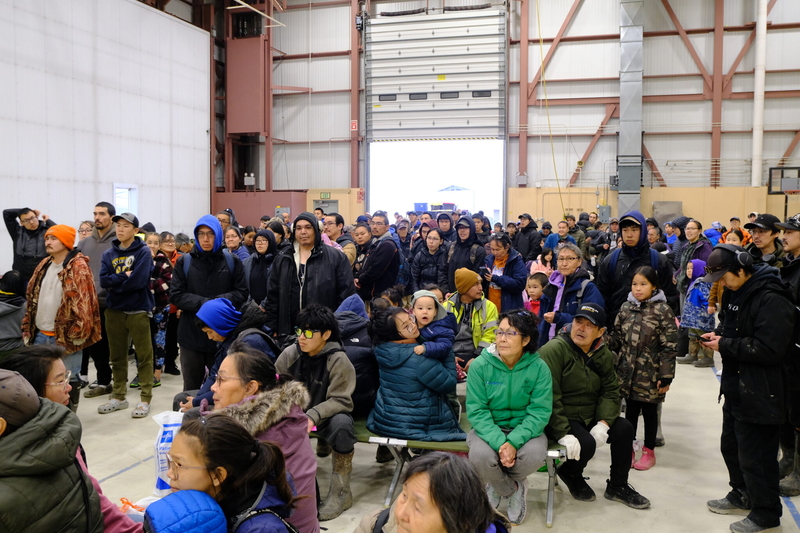 Evacuees of Kipnuk and Kwigillingok wait to board an evacuation flight from Bethel to Anchorage on Oct. 15, 2025 (Photo by Corinne Smith/Alaska Beacon)