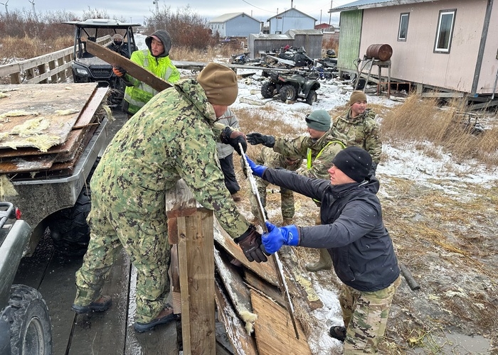 Alaska Organized Militia members assigned to Task Force Bethel continue removing debris and waterlogged insulation from buildings at Tuntutuliak after ex-Typhoon Halong on Oct. 25, 2025. (Alaska National Guard photo by Capt. Balinda O'Neal)