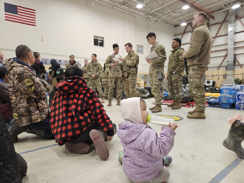 Evacuees wait for their name to be called by members of the Alaska National Guard, for a flight from Bethel to Anchorage on Oct. 15, 2025 (Photo by Corinne Smith/Alaska Beacon)