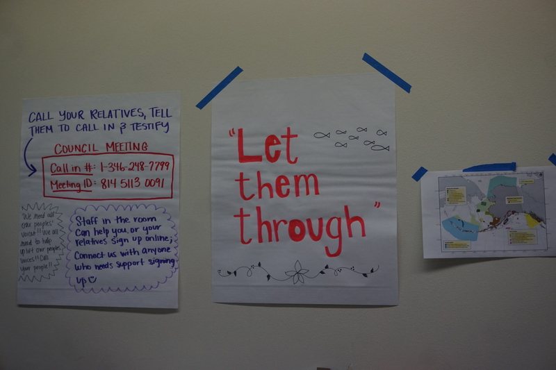 Signs seen Feb. 7, 2026, at a room in the William A. Egan Civic and Convention Center used by tribal organizations attending the North Pacific Fishery Management Council meeting. (Photo by Yereth Rosen/Alaska Beacon)