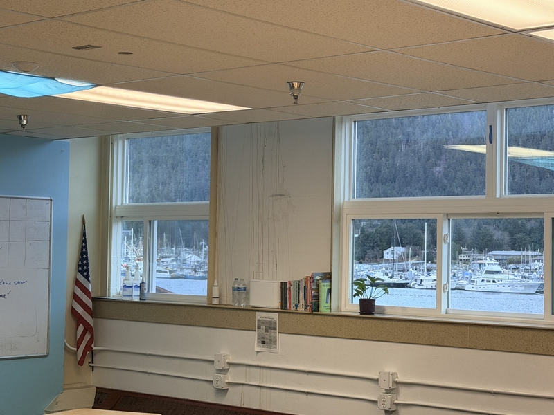 A Mt. Edgecumbe High School classroom with leaks causing water stains on the wall seen on a legislator visit on Feb. 6, 2026. (Photo courtesy of the Senate Finance Committee)
