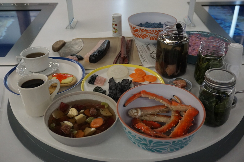 A model of traditional foods for people in the Bering Strait region is displayed at the Bering Land Bridge National Presere visitor center in Nome. The displayed meal, seen April 10, 2026, includes red king crab legs; moose stew; muktuk, or whale fat with skin attached; seal oil; willow greens; and agutiq, or berries mixed with seal oil. (Photo by Yereth Rosen/Alaska Beacon)