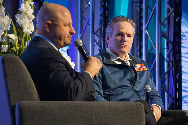 Glenfarne CEO Brendan Duval speaks on May 21, 2026, at the Alaska Sustainable Energy Conference in Anchorage, while Gov. Mike Dunleavy listens. (Photo by Yereth Rosen/Alaska Beacon)