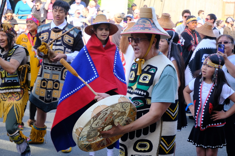 Ricardo Worl with the Chilkat Thunderbird &amp; Sockeye Clans dance groups drums during the procession to the Grand Entrance, part of the opening of Celebration in Juneau on June 3, 2026. (Photo by Corinne Smith/Alaska Beacon)