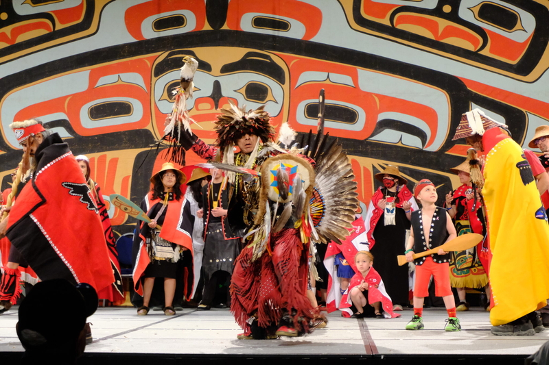 Thomas Yellowhorse Davis who is Oglala Lakota and Tlingit from Hoonah, and dancing with the Mt. Fairweather dance group from Hoonah on the main stage of Centennial Hall during the Grand Entrance of Celebration on June 3, 2026. (Photo by Corinne Smith/Alaska Beacon)