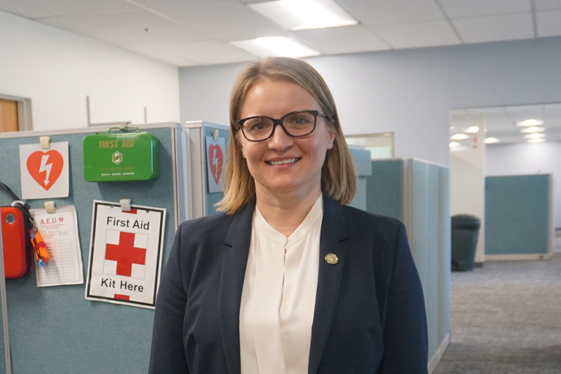 Emma Poken, the Environmental Protection Agency's regional administrator, stands amid work stations at the federal agency's Anchorage office on July 29, 2026. Pokon was previously commissioner of the Alaska Department of Environmental Conservation. (Photo by Yereth Rosen/Alaska Beacon)