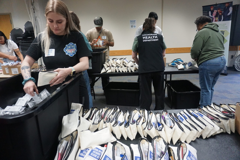 Bernadette Hartley and other volunteers assemble opioid-reversal kits at an Aug. 29, 2025, event in Anchorage. The kits contain naloxone. The event held at Anchorage's Fairview Community Recreation Center was organized by the Alaska Department of Health's Project HOPE and the Alaska Native Tribal Health Consortium. (Photo by Yereth Rosen/Alaska Beacon)