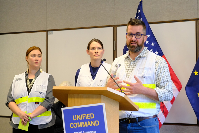 Ryan O’Shaughnessy, emergency manager for the City and Borough of Juneau, Ginny Nadolny, commander of US Coast Guard Southeast Sector (center) and Sabrina Grubitz, public safety manager for Central Council of Tlingit and Haida Indian Tribes of Alaska (left) speak at a news conference ahead of the glacial outburst flood in Juneau on Aug 12, 2026. (Photo by Corinne Smith/Alaska Beacon)