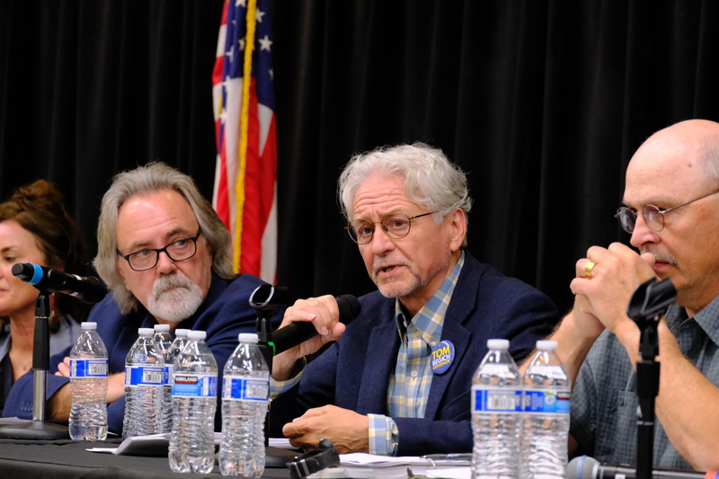 Democrat Tom Begich discusses his education policy platform, with Independent Randy Hoffbeck (left) and Republican Click Bishop (right) at an education debate on July 30, 2026. (Photo by Corinne Smith/Alaska Beacon)