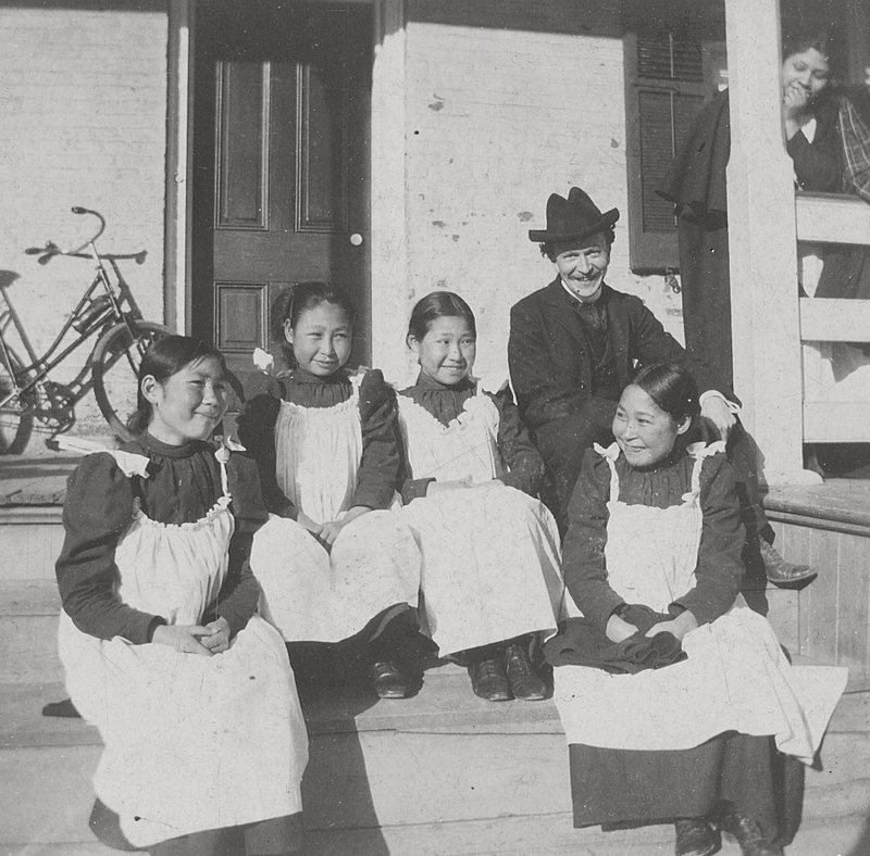 Native Alaska students enjoy a laugh on the grounds of the Carlisle Indian Industrial School. From left are Tummassak, Cooki Glook, Annie Coodlalook, and Annebuck. Tummassak’s relative, Nyché Andrew, says it is the only photo she has seen of the young woman smiling. The man is not identified. Credit: Photo courtesy of Dickinson College Special Collections