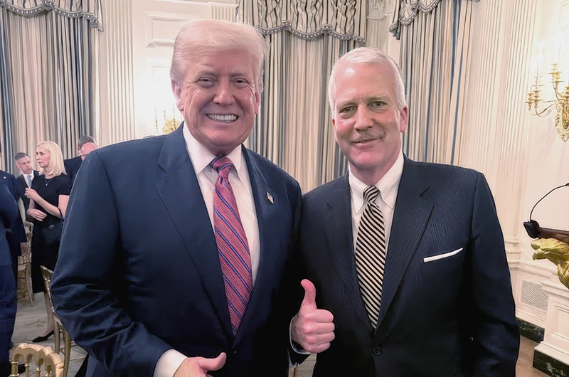 A photo of Sen. Dan Sullivan making a thumbs-up gesture as he stands with President Donald Trump is featured on the incumbent's campaign website. (Photo from dansullivanforalaska.com website)