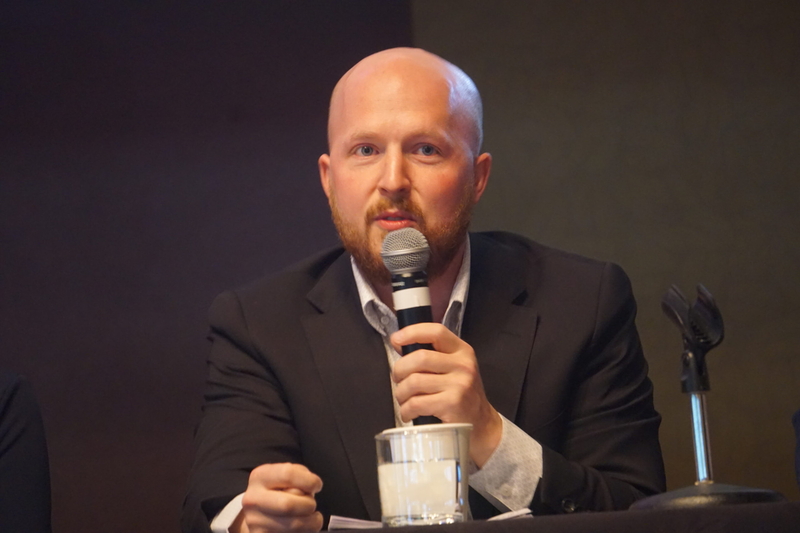 Former State Rep. Jonathan Kreiss-Tomkins, a Democrat, speaks at a gubernatorial candidate forum held in Girdwood on Sept. 16, 2026, by the Alaska Hospital and Healthcare Association. (Photo by Yereth Rosen/Alaska Beacon)