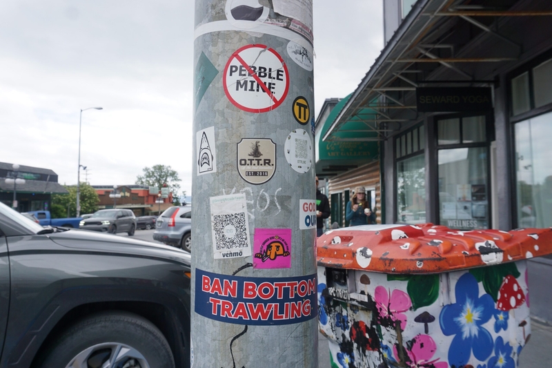 A bumper sticker attached to a pole in downtown Seward, seen on June 27, 2026, carries an anti-trawl message,. (Photo by Yereth Rosen/Alaska Beacon)