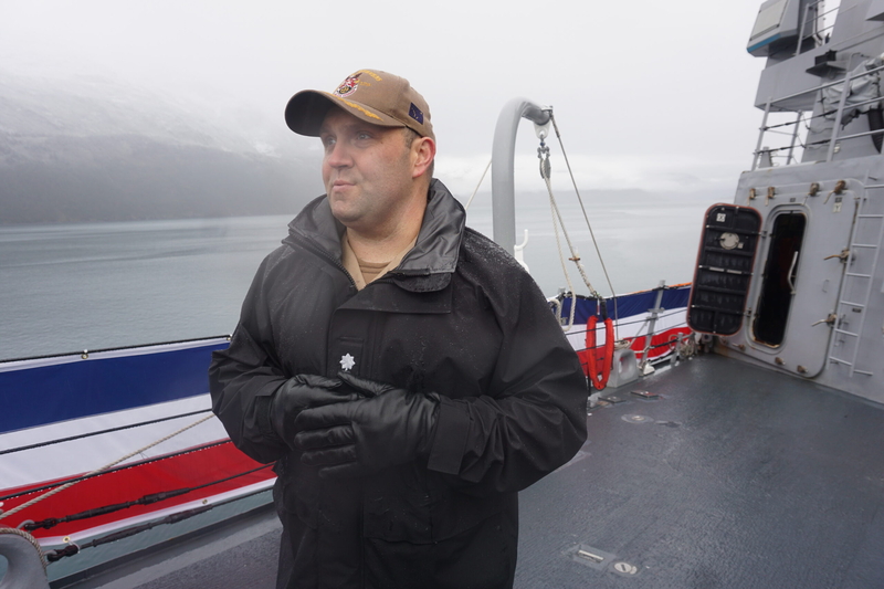 CCommander Stephen Roman, chief executive of the USS Ted Stevens, describes some of the features of the new warship during a media tour on Oct. 1, 2026, Behind him, mist hangs over Prince William Sound waters in Whittier. (Photo by Yereth Rosen/Alaska Beacon)