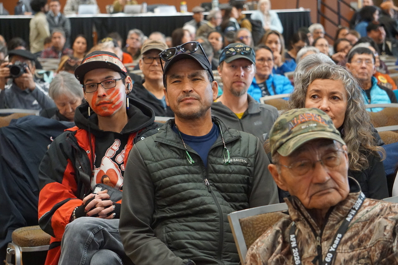 An audience member at the Alaska Federation of Natives convention wears face makeup and a T-shirt with the symbols protesting the high rates of violent crimes against Native women. (Photo by Yereth Rosen/Alaska Beacon)