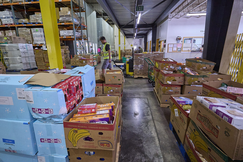 Views of the Hawaii Food Bank which delivers all manner of foods to many individuals and families from their warehouse on Kilihau Street. (David Croxford/Civil Beat/2025)