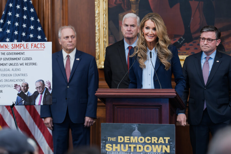 Small Business Administration head Kelly Loeffler, center, is joined by, from left, Majority Leader Steve Scalise, R-La., Majority Whip Tom Emmer, R-Minn., and Speaker of the House Mike Johnson, R-La., at a news conference on day 27 of the government shutdown, at the Capitol in Washington, Monday, Oct. 27, 2025. (AP Photo/J. Scott Applewhite)