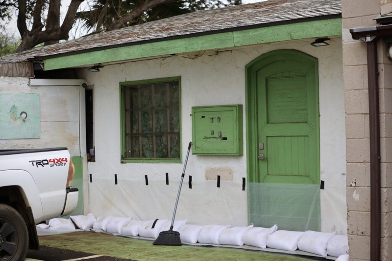 A home on South Kīhei road was prepared for flooding Thursday after cleaning up from March's back-to-back Kona low storms. (Erin Nolan/Civil Beat/2026)