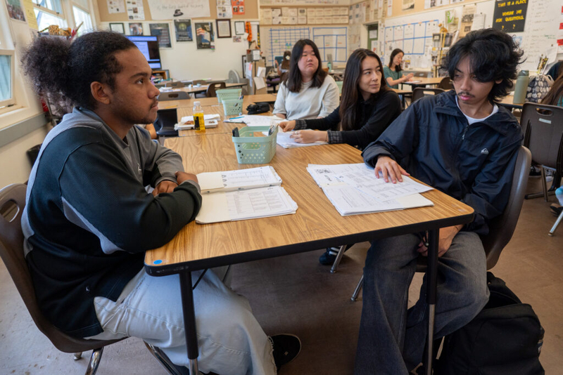 McKinley High School students work on an exercise using only pencil and paper May 1, 2026. From left are: Jude Marengo, Sylvia Lee, Lia Baker and Lian (cq) Adamana. (Craig Fujii/Civil Beat/2026)