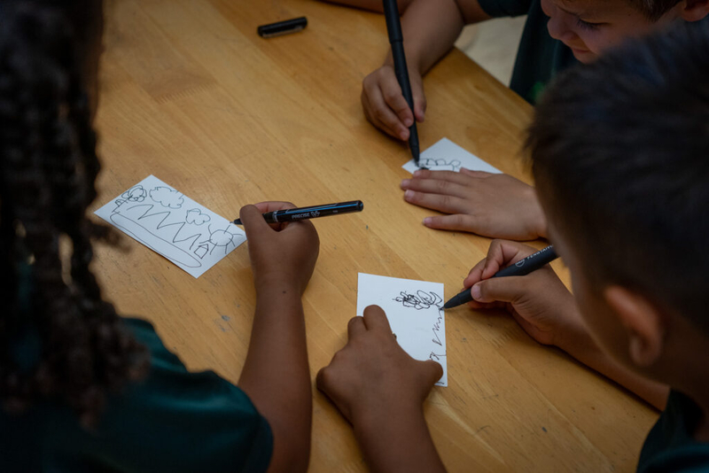 Students work to answer a question with small focused drawings in a class at Mid-Pacific Institute in Mānoa May 6, 2026. The children here are five years old. (Craig Fujii/Civil Beat/2026)