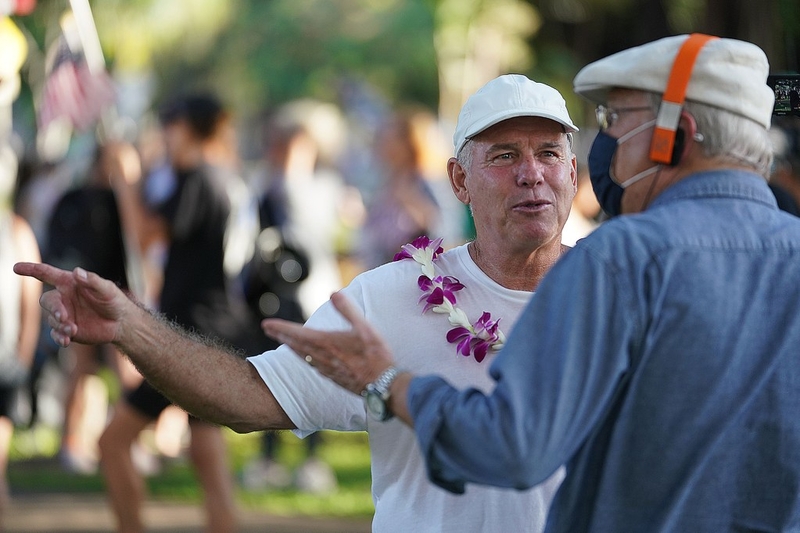 Gary Cordery, director of the Aloha Freedom Coalition speaks to a supporter before the march from Honolulu Zoo to Lewers Street in Waikiki on saturday.