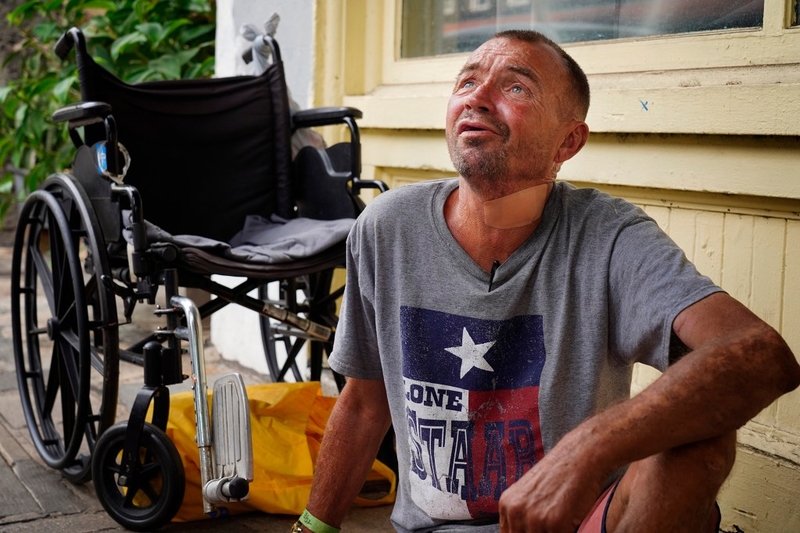 Troy Broughton, 56, talks with street medicine volunteers during their rounds on the homeless community in Chinatown Tuesday, Nov. 4, 2025, in Honolulu. (Kevin Fujii/Civil Beat/2025)